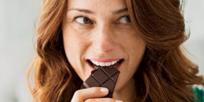 happy-woman-eating-chocolate-0710-410x290