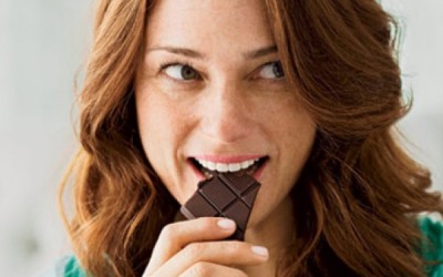 happy-woman-eating-chocolate-0710-410x290
