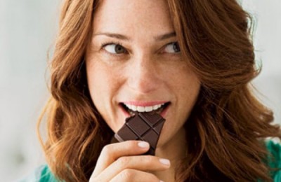 happy-woman-eating-chocolate-0710-410x290