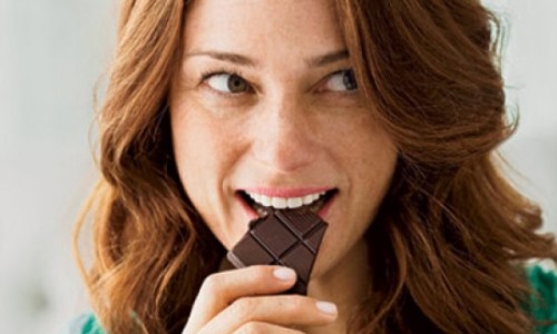 happy-woman-eating-chocolate-0710-410x290